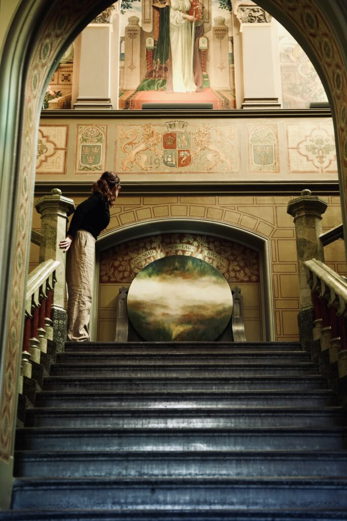 Nathalie Thengius in the entrence hall of Landskrona Rådhus, where she has her art studio on the second floor